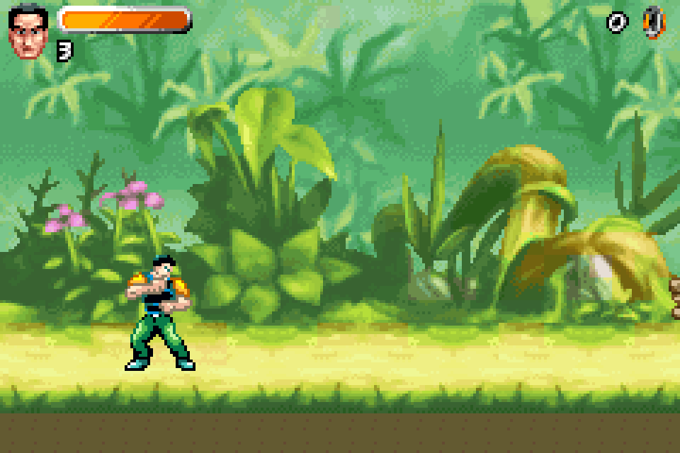 Action Man in a jungle with plants in the foreground and leaves behind him, a health bar and a lives counter at the top.