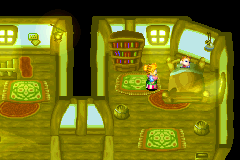Golden Sun's opening scene: a room at night, brightened by a lamp's glow and light from the windows, with Isaac in bed and his mother next to it.