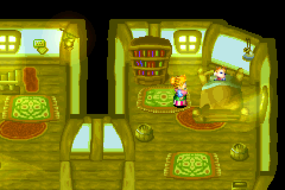 A room at night, brightened by a lamp's glow and light from the windows.