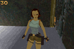 Lara Croft standing in a dim cave corridor in OpenLara's Caves level.